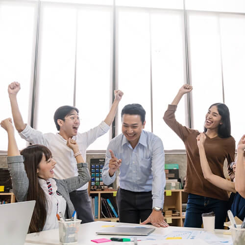 happy employees at a creative web design company in singapore