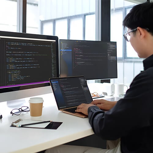 Dark Mode Website Designer Working With A Computer