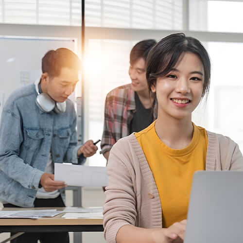 Smiling Female Web Designer at full-service Website design agency in Singapore