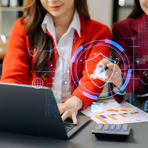 Singaporean Female Website Developer For Ai Industry Working With Her Colleague