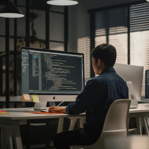 Singaporean WordPress Website Developer Working at the Office