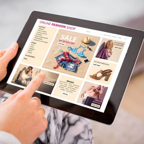 Singaporean Web Designer At An Ecommerce Web Design Company Browsing Online Store