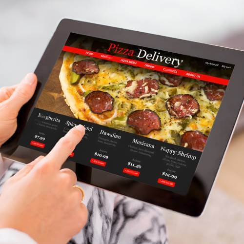 Singaporean Customer Browsing A Website Created By A Web Design Company For Restaurants