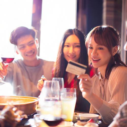Singaporean Young Diner Paying Through A Website Created By A Web Designer For F&b Industry