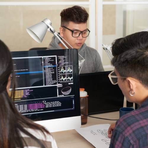 Singaporean Developers At A Web Design Agency For Artificial Intelligence Company Collaborating