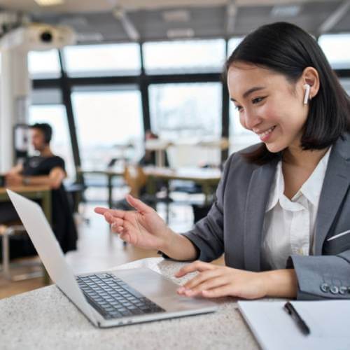 Singaporean Corporate Exec Viewing A Website Created By A Web Developer For Corporate Website
