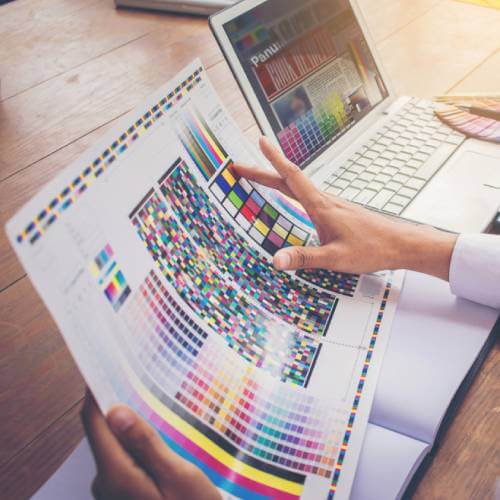 Singaporean Printing Agency Executives Discussing With A Website Designer For Printing Agency