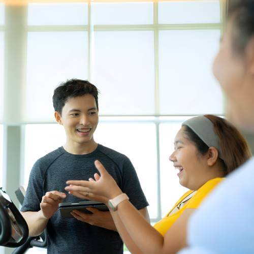 Singaporean Trainer Showing A Website Created By A Web Design Company For Fitness Center