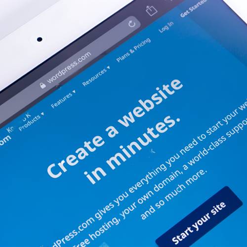Singaporean Wordpress Developer At A Wordpress Web Design Company Working With Ipad